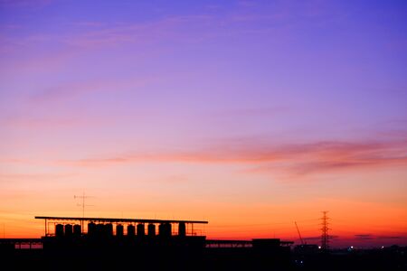 sunset sky shading background from orange to blueの写真素材
