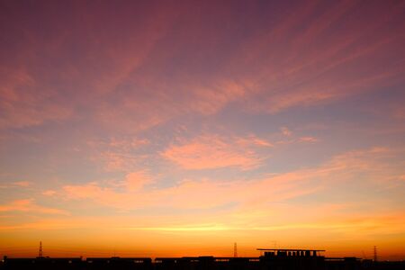 sunset sky shading background from orange to blueの写真素材
