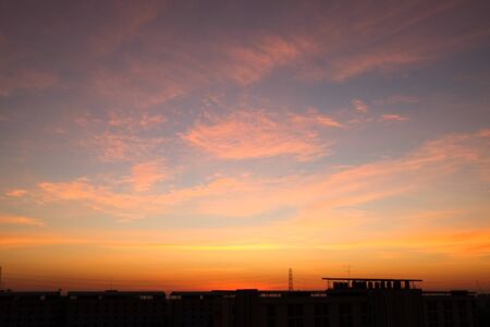 sunset sky shading background from orange to blueの写真素材