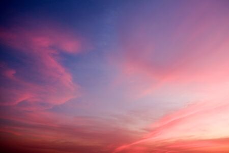 sunset sky shading background from orange to blueの写真素材
