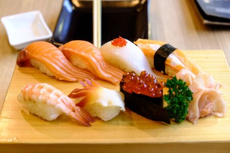 sushi set in the japanese wood dishの写真素材