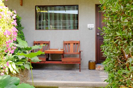 wood chair furniture in front of the houseの写真素材