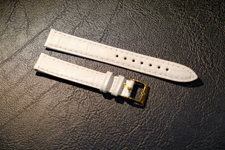 leather watch strap object isolate on the leather backgroundの写真素材