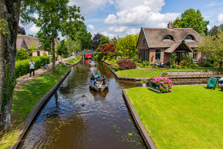 Giethoorn Cruise,Giethoorn The Netherlands -July 6 ,2023: Many tourists cruise in Giethoorn, Holland, Netherlandsのeditorial素材