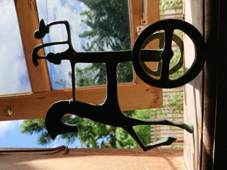 silhouette of a bronze figurine of Athena in her chariot while holding an owl.のeditorial素材