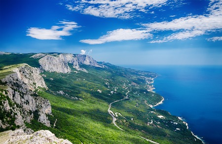 beautiful landscape, the view from the mountains to the coast and the road stretching into the distanceの写真素材