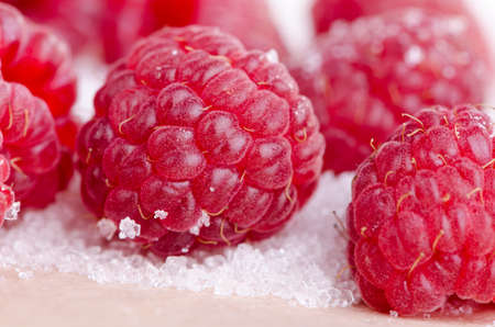 fresh berries, raspberries with sugar close upの写真素材