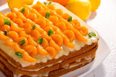 Cake, citrus pie, decorated with mandarin and mintの写真素材