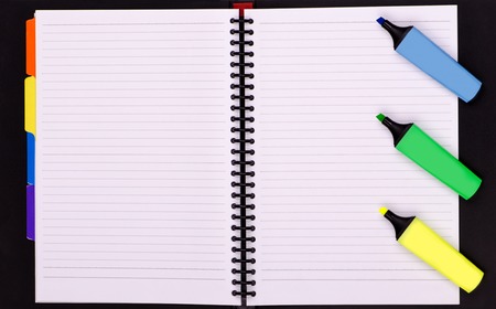 Office supplies, open notebook in line and color markersの写真素材