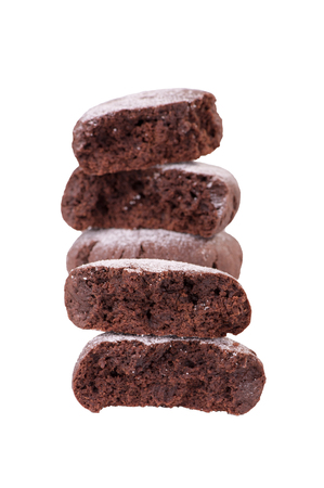 Chocolate cookies stacked, isolated on white, selective focus, close-upの写真素材