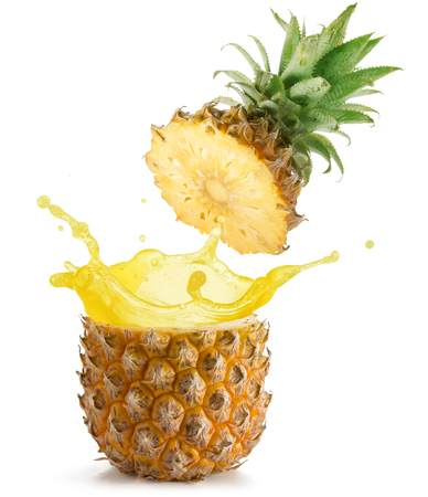 juice splashing out of a pineapple isolated on white backgroundの写真素材