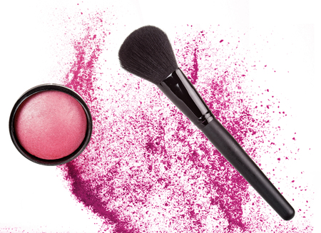 pink blush and black brush over crushed powder isolated on whiteの写真素材