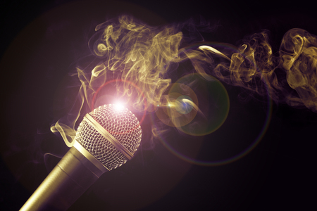 microphone and swirl of smoke on black backgroundの写真素材