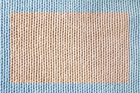 Knitted fabric - macro of a woolen texture