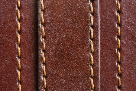 Natural brown leather background closeup