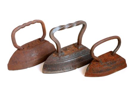 Old flatirons on a white backgroundの写真素材