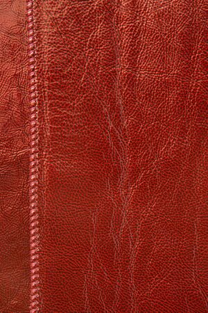 Natural red leather background closeupの写真素材
