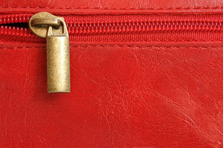Red leather with zipper background closeupの写真素材