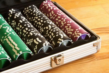 A set of casino chips on a wooden table