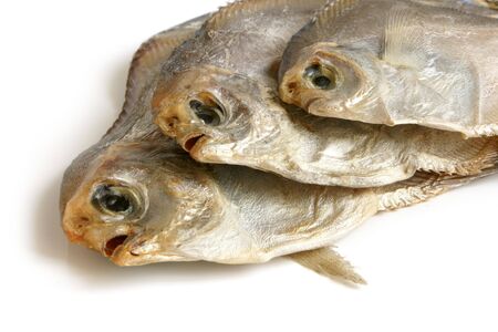 Dried piranhas on white background