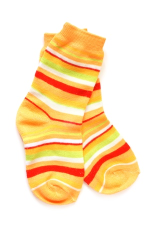 Pair of child's striped socks on a white backgroundの写真素材