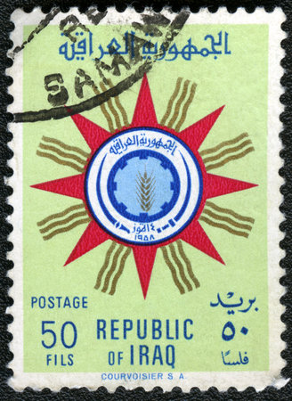 IRAQ - CIRCA 1959: A stamp printed in Iraq shows State Emblem of Republic of Iraq, circa 1959のeditorial素材