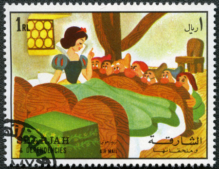 SHARJAH & DEPENDENCIES - CIRCA 1972: A stamp printed by Sharjah & Dependencies devoted fifty years of Walt Disney cartoon characters, shows Snow White and the seven dwarfs, series, circa 1972のeditorial素材