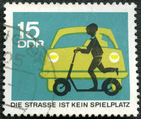 GERMANY - CIRCA 1966: A Stamp printed in Germany shows automobile and child with scooter, circa 1966