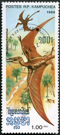 KAMPUCHEA - CIRCA 1986: A stamp printed by Kampuchea shows Rhamphorhynchus, series devoted to prehistoric animals, circa 1986の写真素材