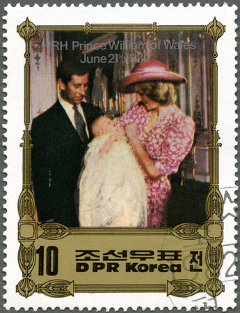 NORTH KOREA - CIRCA 1982: A stamp printed in DPR Korea shows Charles and Diana with Prince William (Charles in suit, Diana in pink hat and dress), Birth of Prince William of Wales, circa 1982のeditorial素材
