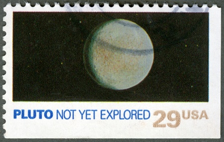 UNITED STATES OF AMERICA - CIRCA 1991: A stamp printed by USA shows Pluto, not yet explored, Space Exploration Series, circa 1991の写真素材