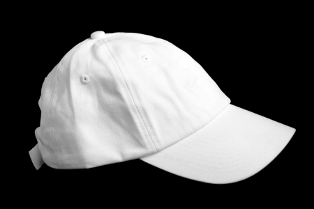 White baseball cap isolated on black backgroundの写真素材