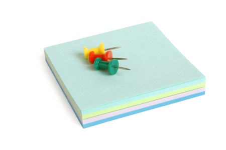 Reminder notes and drawing pins on the white background
