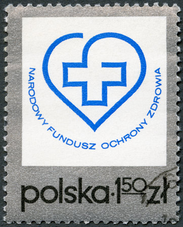 POLAND - CIRCA 1975: A stamp printed in Poland shows Health Fund Emblem, circa 1975のeditorial素材