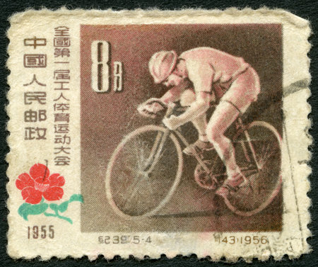 CHINA - CIRCA 1957: A stamp printed in China shows Bicycling, First National Workers Sports Meeting, circa 1957のeditorial素材