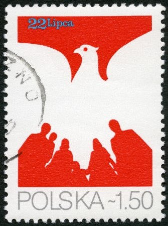 POLAND - CIRCA 1979: A stamp printed in Poland shows Eagle and People, devoted 35th anniversary of the Polish People's Republic, circa 1979の写真素材