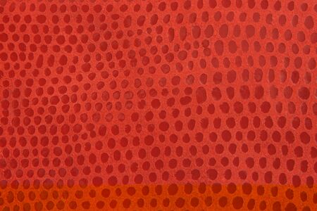 Natural red leather background closeup
