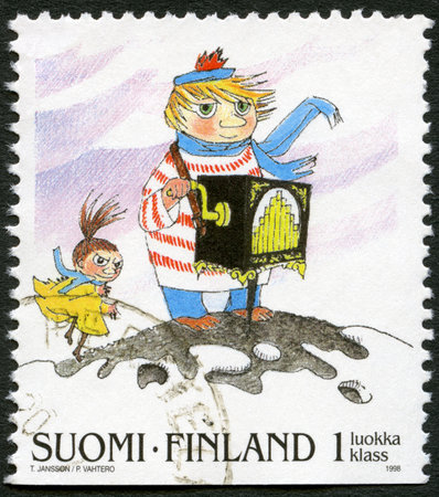 FINLAND - CIRCA 1998: A stamp printed in Finland shows Moomin Cartoon Characters, by Tove Jansson: Organ grinder, circa 1998のeditorial素材