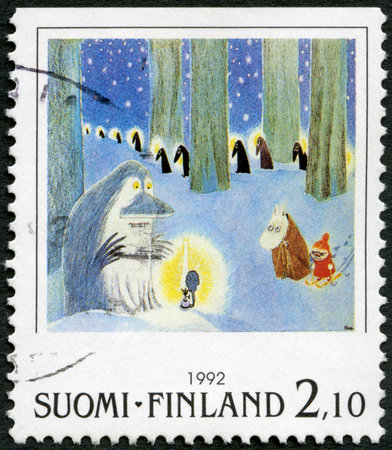 FINLAND - CIRCA 1992: A stamp printed in Finland shows Moomin Cartoon Characters, by Tove Jansson: Winter scene in forest, circa 1992のeditorial素材
