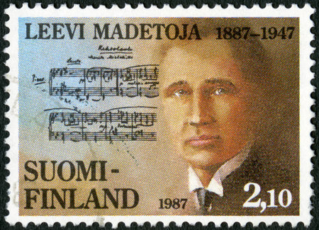 FINLAND - CIRCA 1987  A stamp printed in Finland shows Leevi Madetoja  1887-1947 , composer, circa 1987のeditorial素材