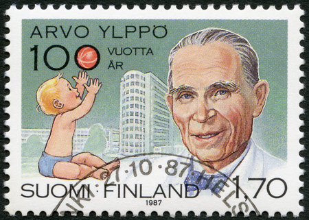 FINLAND - CIRCA 1987: A stamp printed in Finland shows Arvo Ylppo (1887-1992), pediatrics pioneer, Child and Lastenlinna Childrens Hospital, circa 1987のeditorial素材