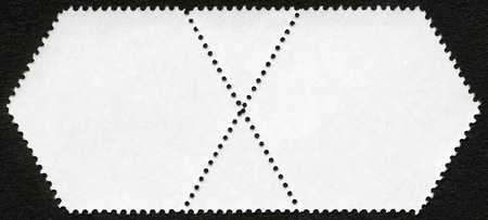 Blank postage stamp block on a black backgroundの写真素材