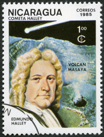 NICARAGUA - CIRCA 1985: A stamp printed in Nicaragua shows Edmond Halley (1656-1742) and Halley's Comet, circa 1985のeditorial素材