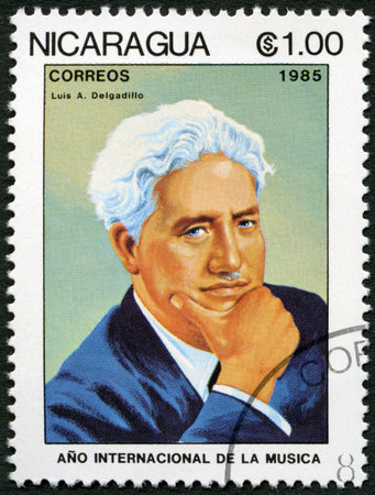 NICARAGUA - CIRCA 1985: A stamp printed in Nicaragua shows Luis A. Delgadillo (1887-1961), series International Music Year, circa 1985のeditorial素材