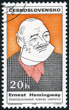 CZECHOSLOVAKIA - CIRCA 1968: A stamp printed in Czechoslovakia shows portrait of Ernest Hemingway (1899-1961), series Cultural personalities of the 20th centenary and UNESCO, circa 1968のeditorial素材