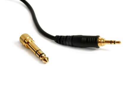 Stereo adapter mini-jack to jack (3,5mm to 6,3mm) on a white backgroundの写真素材