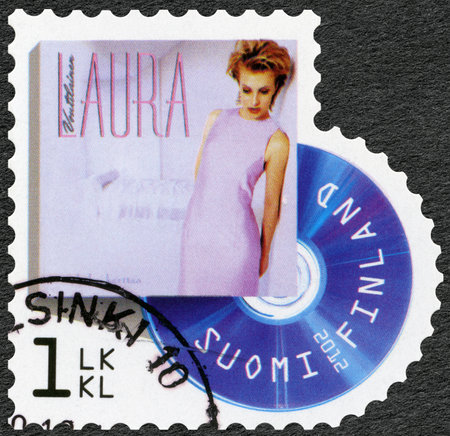 FINLAND - CIRCA 2012: A stamp printed in Finland shows Laura Voutilainen, series on Finnish music has reached the 1990's, circa 2012のeditorial素材