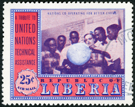 LIBERIA - CIRCA 1954: A stamp printed in Liberia shows Geography class, series UN Technical Assistance Agencies, circa 1954のeditorial素材