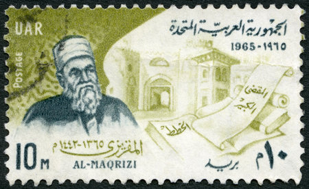 EGYPT - CIRCA 1965: A stamp printed in Egypt shows Ahmed Al-Maqrizi (1365-1442), historian, buildings and books, circa 1965のeditorial素材