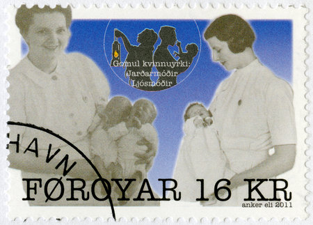 FAROE ISLANDS - CIRCA 2011: A stamp printed in Faroe Islands shows The Nurses - Marianna and Petra, series Traditional Female Professions, circa 2011のeditorial素材
